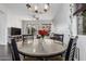 Comfortable dining area features views from the window, a ceiling fan, and access to the living room at 2330 E Stephens Pl, Chandler, AZ 85225