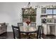 Cozy dining area with a chandelier, adjacent to a window with outdoor views at 2330 E Stephens Pl, Chandler, AZ 85225