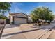 Charming single-Gathering home featuring a spacious driveway and well-manicured landscaping at 2330 E Stephens Pl, Chandler, AZ 85225