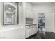 Hallway with built-in cabinetry and view into primary bedroom at 2330 E Stephens Pl, Chandler, AZ 85225
