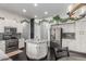 Bright kitchen featuring white cabinets, stainless steel appliances and a center island with granite countertop at 2330 E Stephens Pl, Chandler, AZ 85225