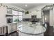 Spacious kitchen featuring white cabinets, stainless steel appliances, granite countertops, and island at 2330 E Stephens Pl, Chandler, AZ 85225