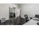 This home office includes hardwood flooring, an open doorway and sliding closet doors at 2330 E Stephens Pl, Chandler, AZ 85225