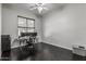 This home office has a large window with natural light and hardwood flooring at 2330 E Stephens Pl, Chandler, AZ 85225