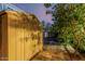 Durable backyard shed offering ample storage space, complemented by a vibrant citrus tree at 2330 E Stephens Pl, Chandler, AZ 85225