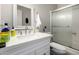 Well-lit bathroom featuring a bright, modern vanity and a glass-enclosed shower at 2514 N 22Nd Ave, Phoenix, AZ 85009
