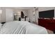 A bedroom is featured with a queen-sized bed and an open doorway to a bathroom with a vanity at 2514 N 22Nd Ave, Phoenix, AZ 85009