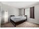 Cozy bedroom with neutral walls, carpeted floors, and a window providing natural light at 2514 N 22Nd Ave, Phoenix, AZ 85009
