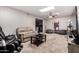 A cozy living room includes carpeting, a lounge area, and comfortable seating options at 2514 N 22Nd Ave, Phoenix, AZ 85009