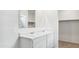 Bright bathroom features double sink vanity, large mirror, and walk in closet at 25183 N 183Rd Dr, Wittmann, AZ 85361