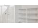 Clean bathroom showcases walk-in shower, closet, and white finishes at 25183 N 183Rd Dr, Wittmann, AZ 85361