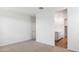 Comfortable bedroom offers neutral carpet, closet access, and view into the attached bath at 25183 N 183Rd Dr, Wittmann, AZ 85361