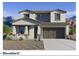Charming two-story home with desert landscaping, paired with a multi-car garage and mountain views at 27382 N 69Th Dr, Peoria, AZ 85383