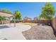 View of the backyard featuring a covered patio, yard, and desert landscaping at 2847 S 161St Dr, Goodyear, AZ 85338