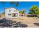 View of the backyard featuring a covered patio, ample space and desert landscaping at 2847 S 161St Dr, Goodyear, AZ 85338