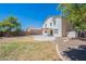 View of the spacious backyard with a covered patio and expansive yard at 2847 S 161St Dr, Goodyear, AZ 85338