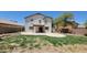 Large backyard with green grass, patio space, and privacy fence at 2847 S 161St Dr, Goodyear, AZ 85338