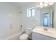 Clean and bright bathroom featuring a tub, shower, toilet, and vanity at 2847 S 161St Dr, Goodyear, AZ 85338