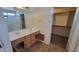 Bathroom featuring a double sink vanity and walk-in closet at 2847 S 161St Dr, Goodyear, AZ 85338