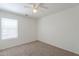 Bright bedroom featuring a neutral carpet and a window for natural light at 2847 S 161St Dr, Goodyear, AZ 85338