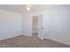 Spacious bedroom with neutral walls, carpet, and open doorway at 2847 S 161St Dr, Goodyear, AZ 85338
