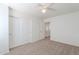 Bedroom featuring carpet, closet with sliding doors, and doorway leading to the next room at 2847 S 161St Dr, Goodyear, AZ 85338