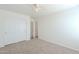 Bedroom featuring carpet, closet with sliding doors, and doorway leading to the next room at 2847 S 161St Dr, Goodyear, AZ 85338