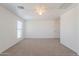 Spacious bedroom with neutral carpet, ceiling fan and natural light from large window at 2847 S 161St Dr, Goodyear, AZ 85338