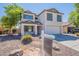 Charming two-story home with a well-manicured front yard and inviting curb appeal, painted in an attractive neutral color at 2847 S 161St Dr, Goodyear, AZ 85338