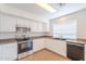 Modern kitchen with stainless steel appliances, granite countertops, and bright lighting at 2847 S 161St Dr, Goodyear, AZ 85338