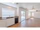 Bright kitchen features a sink, granite countertops, dishwasher, and slider door to the backyard at 2847 S 161St Dr, Goodyear, AZ 85338