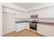 Kitchen with stainless appliances, granite counters and white cabinets at 2847 S 161St Dr, Goodyear, AZ 85338