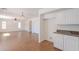 Bright kitchen view from living space with white cabinets and stainless steel appliances at 2847 S 161St Dr, Goodyear, AZ 85338