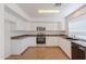 Well-lit kitchen features stainless steel appliances and ample granite counter space at 2847 S 161St Dr, Goodyear, AZ 85338