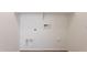 Close up of the laundry room's hookups for a washer and dryer at 2847 S 161St Dr, Goodyear, AZ 85338