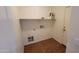 Functional laundry room with built-in shelf at 2847 S 161St Dr, Goodyear, AZ 85338
