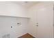 The laundry room features tile flooring and includes hookups for a washer and dryer at 2847 S 161St Dr, Goodyear, AZ 85338