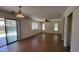 Open living space with tile floors, ceiling fan, and sliding glass doors at 2847 S 161St Dr, Goodyear, AZ 85338