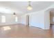 Open living room with tile floors, recessed lights, a ceiling fan, and a sliding closet door at 2847 S 161St Dr, Goodyear, AZ 85338