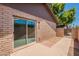 Backyard patio features brick accents and a sliding glass door at 31 W Loma Vista Dr # 102, Tempe, AZ 85282