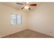 Neutral bedroom with ceiling fan and large window provides great lighting at 31 W Loma Vista Dr # 102, Tempe, AZ 85282
