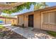 A home featuring an inviting front door with desert landscaping and a covered carport at 31 W Loma Vista Dr # 102, Tempe, AZ 85282