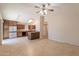 Open-concept kitchen with dark wood cabinetry, granite countertops, stainless steel appliances, and adjacent dining area at 31 W Loma Vista Dr # 102, Tempe, AZ 85282