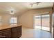 Spacious living room with sliding glass doors and granite breakfast bar offers great natural light at 31 W Loma Vista Dr # 102, Tempe, AZ 85282