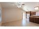 Spacious living room featuring neutral tones, tile floors, and sliding glass door that leads to patio at 31 W Loma Vista Dr # 102, Tempe, AZ 85282