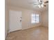 Bright living room with neutral walls, tile flooring, window with blinds, and a ceiling fan at 31 W Loma Vista Dr # 102, Tempe, AZ 85282