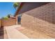 Enclosed patio with brick walls and gravel area, perfect for outdoor relaxation and entertaining at 31 W Loma Vista Dr # 102, Tempe, AZ 85282