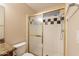 Shower featuring glass doors, unique black and white tile accents and chrome shower head at 31 W Loma Vista Dr # 102, Tempe, AZ 85282