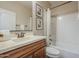 Bright bathroom features a shower-tub combo, framed mirror, and neutral tones at 3721 W Aracely Dr, New River, AZ 85087