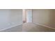 A vacant bedroom featuring neutral walls, carpet floors, and an entry to another room at 3721 W Aracely Dr, New River, AZ 85087
